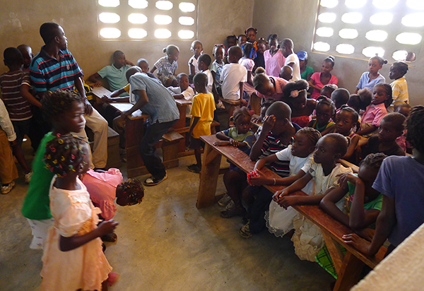 Children file into a new classroom at Flower of Hope.